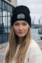 GataKarma Marea Cuffed Beanie, black, on a stone quay (6/6) — MAREA collection by BarnaBorders
